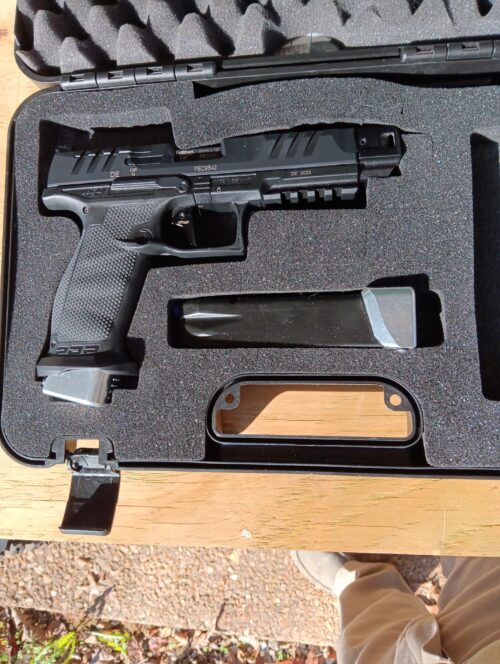 Handgun in protective case on table