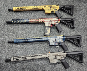 Four rifles with 'Take America Back' designs.