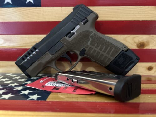 Handgun with magazine on American flag background.