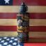 Butch's Gun Oil bottle on American flag background.