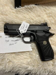 Wilson Combat pistol with price tag on display.