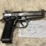 Beretta 92X pistol with price tag on notes.