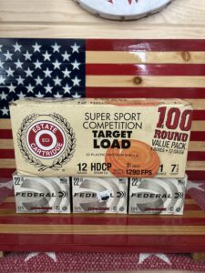 Ammunition boxes on wooden background with flag design.