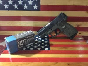 9mm pistol and ammo on American flag background