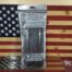 American Tactical rifle magazine packaging on flag background.