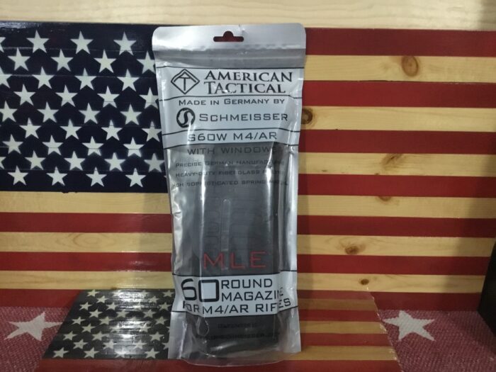 American Tactical rifle magazine packaging on flag background.