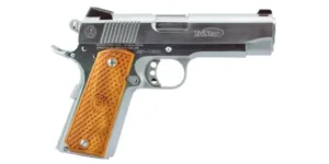 Silver handgun with brown grip.