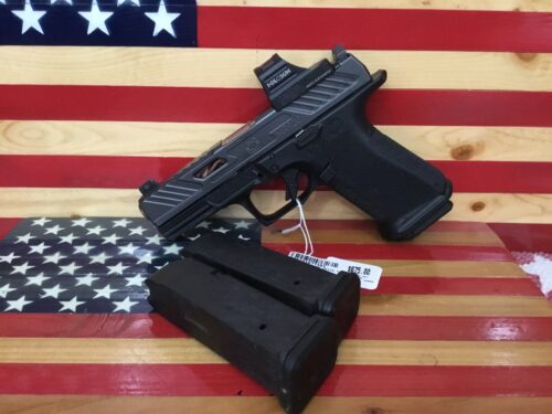 Handgun and magazines on American flag background