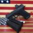 Handgun and magazines on American flag background