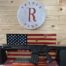 Black rifle displayed on American flag background.