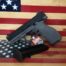 Handgun and magazine on American flag background