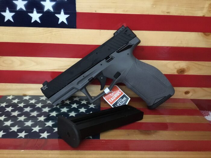 Handgun and magazine on American flag background