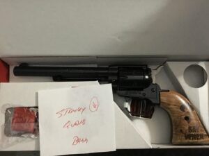 Revolver in box with wooden grip