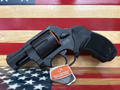 Black revolver on American flag background