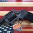 Black revolver on American flag background