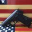 Handgun with American flag background
