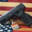 Taurus GX2 pistol on American flag background.