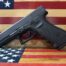 Handgun on American flag background