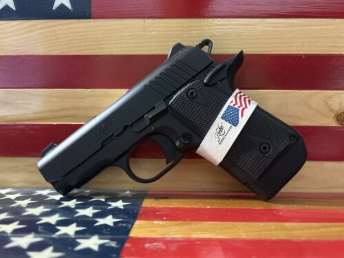 Handgun on American flag background
