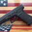 Black handgun on American flag background