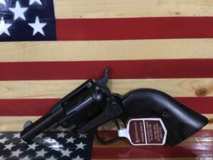 Revolver on wooden American flag background