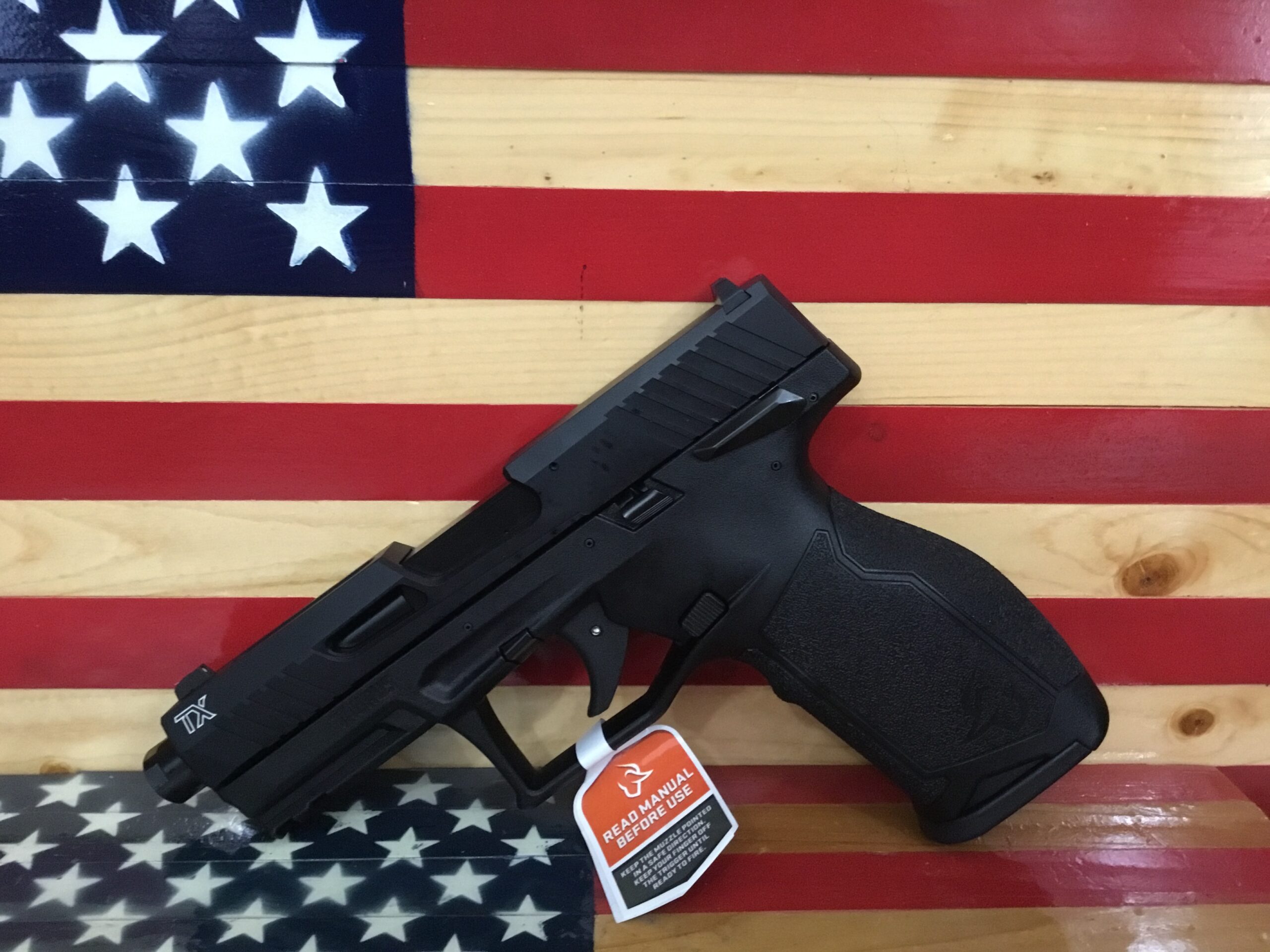 Handgun on American flag background