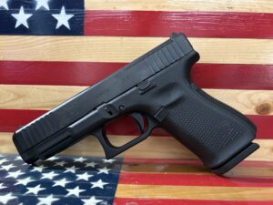 Handgun against American flag background.