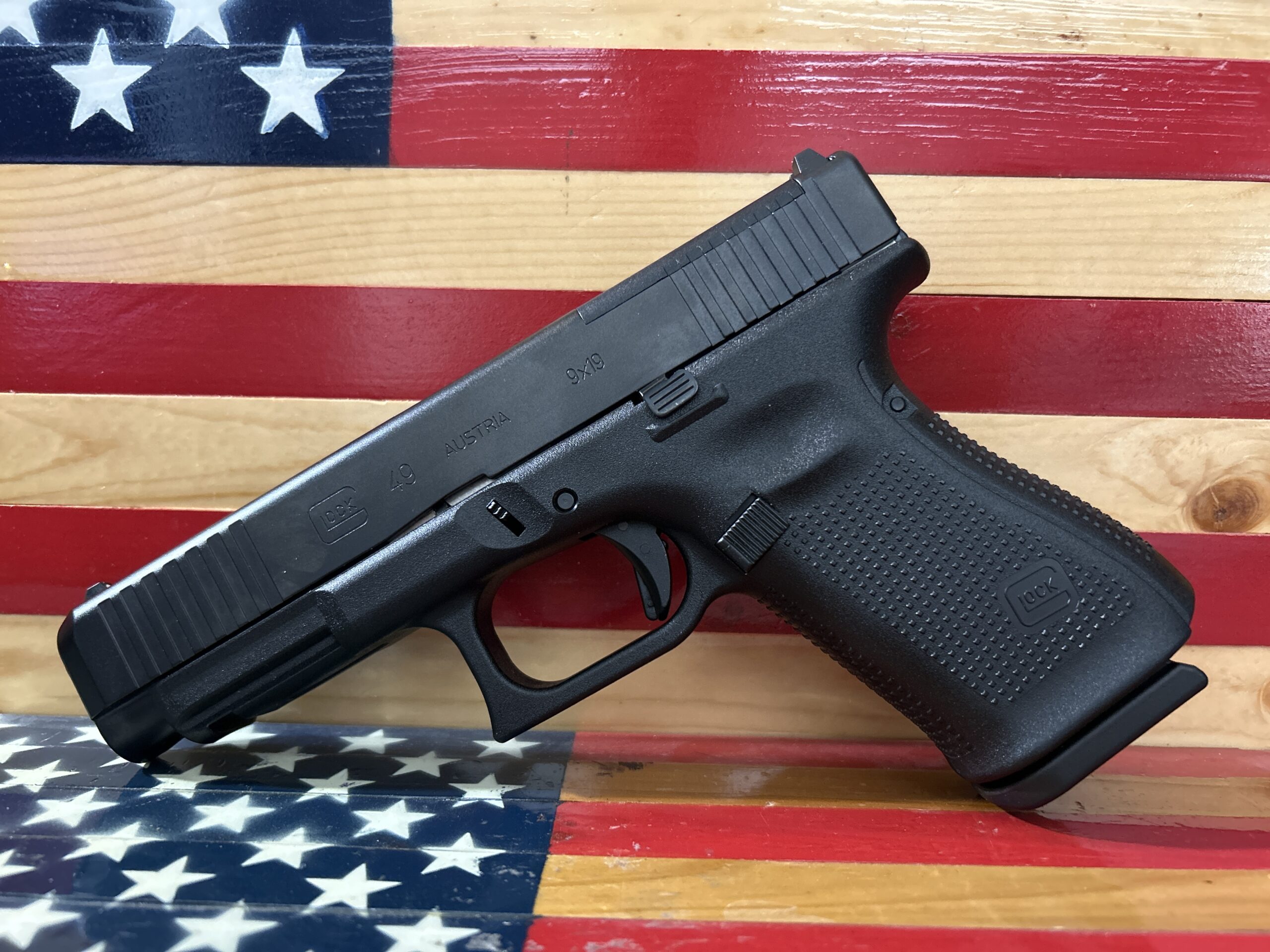 Handgun against American flag background.