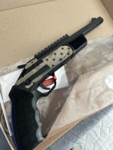 Patriotic themed revolver in cardboard box