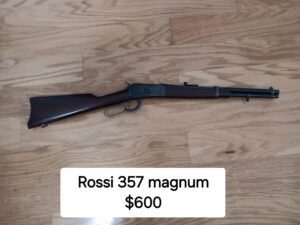 Rossi 357 Magnum rifle on wooden floor.