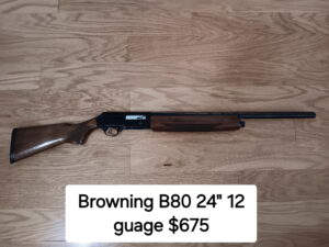 Browning B80 shotgun on wooden floor.