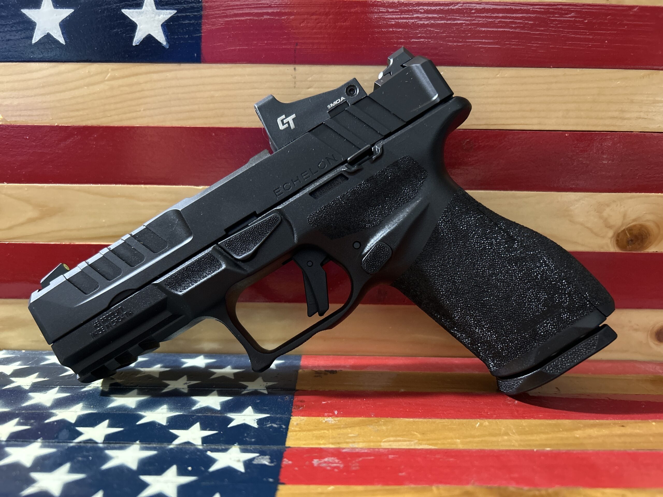 Black handgun on American flag background