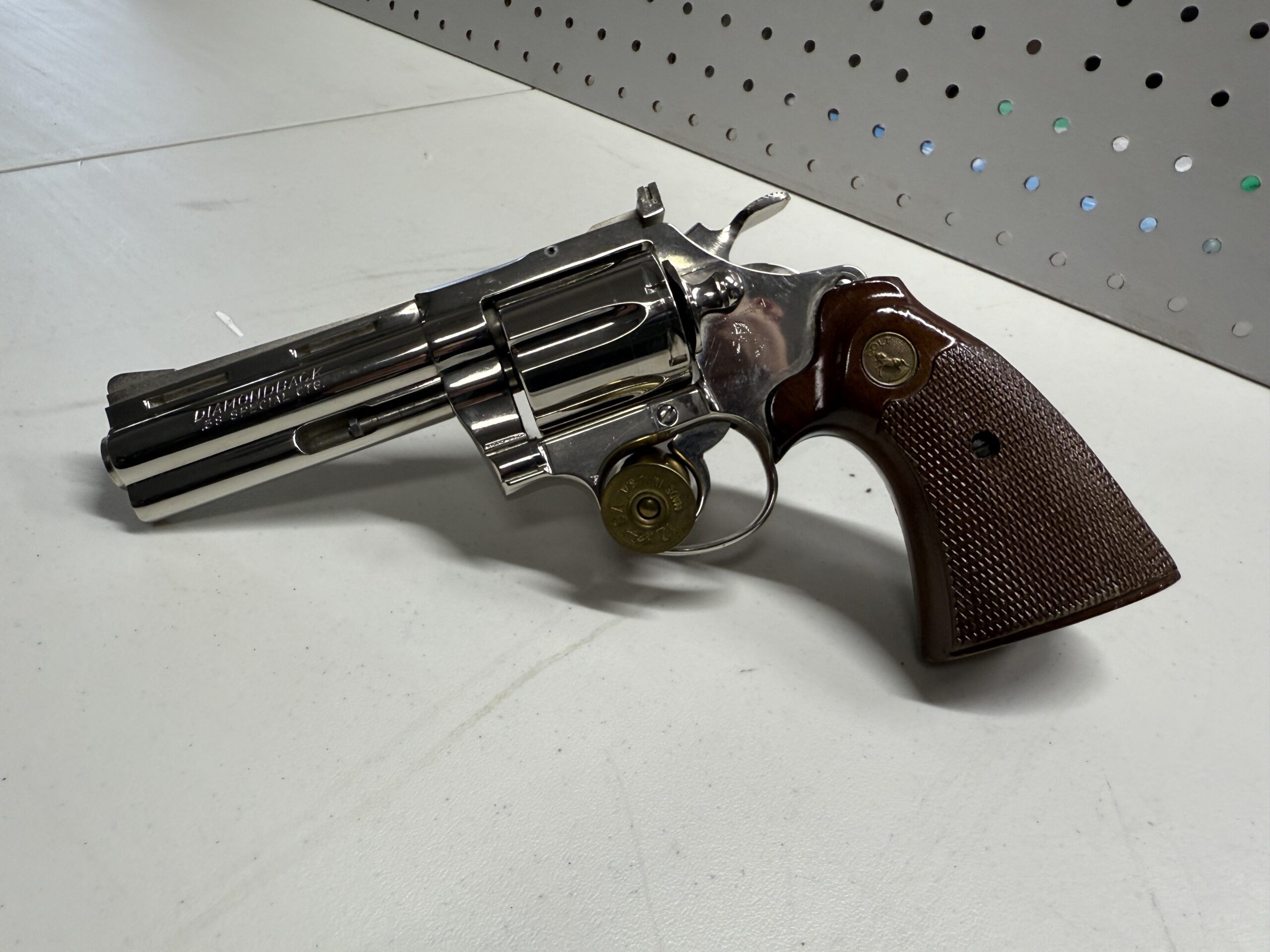 Revolver gun with wooden handle on table