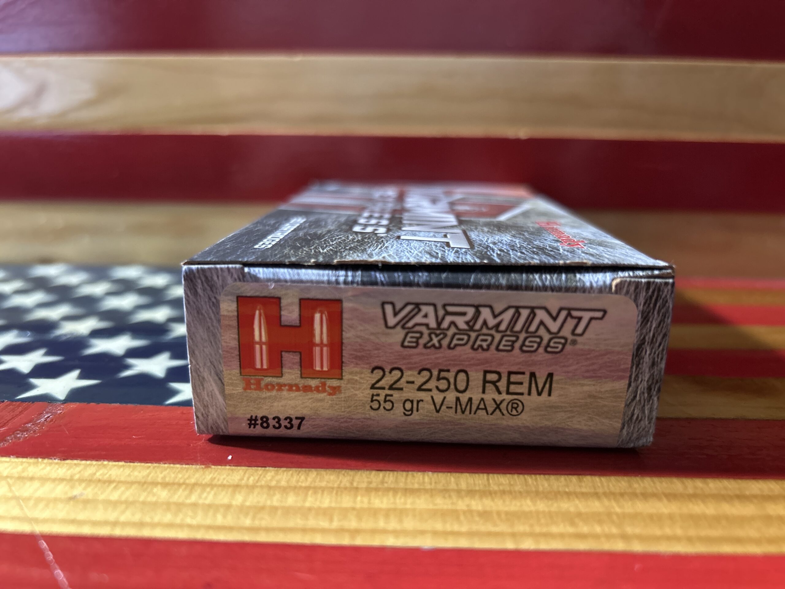 Hornady ammunition box on American flag background.
