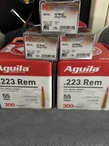 Boxes of .223 Rem and .44 MAG ammunition.