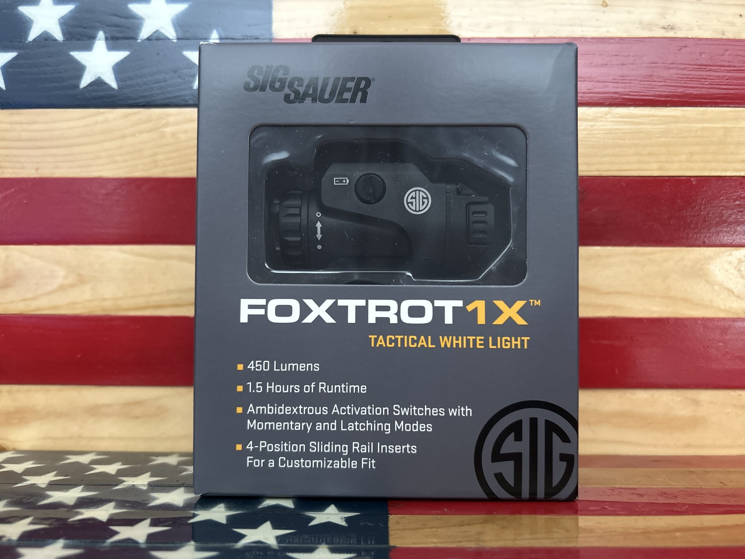 Foxtrot1X tactical light box on flag background.