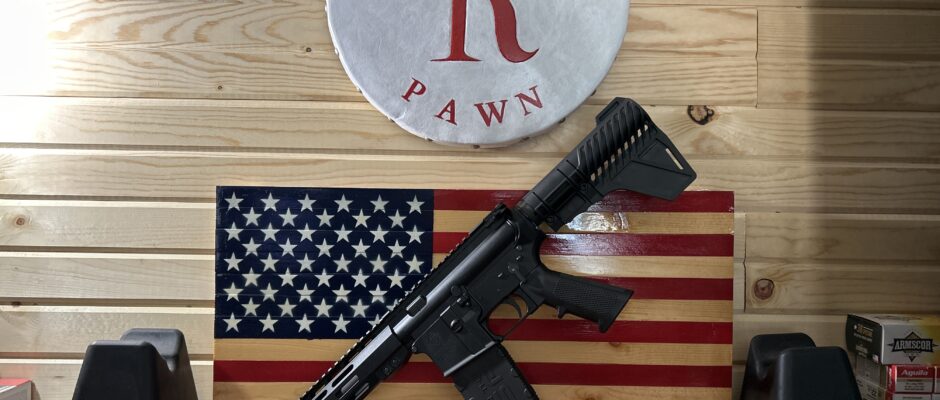 Rifle displayed on American flag backdrop
