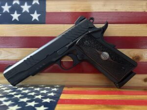 Pistol on wooden American flag background