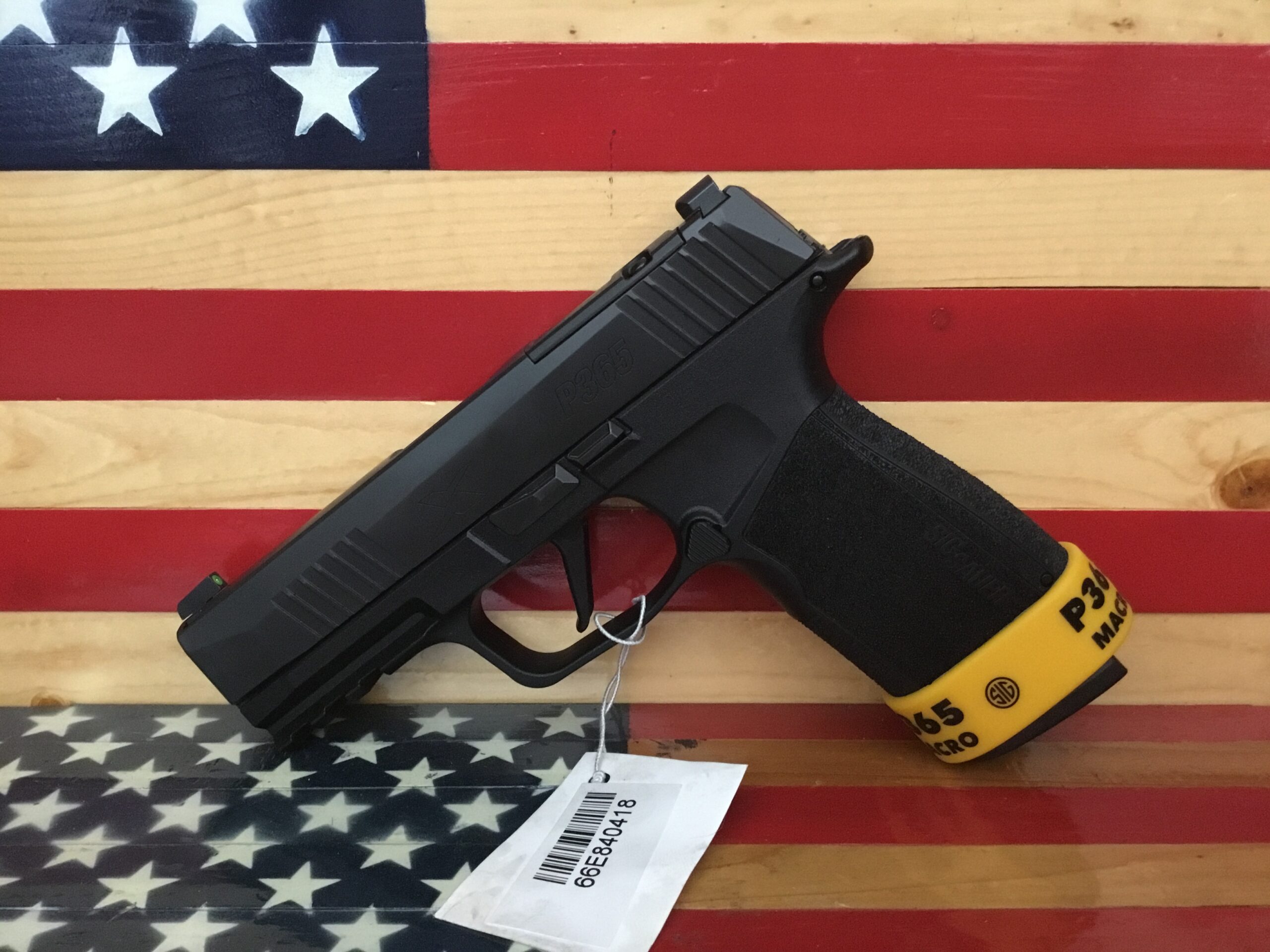 Handgun displayed on American flag background