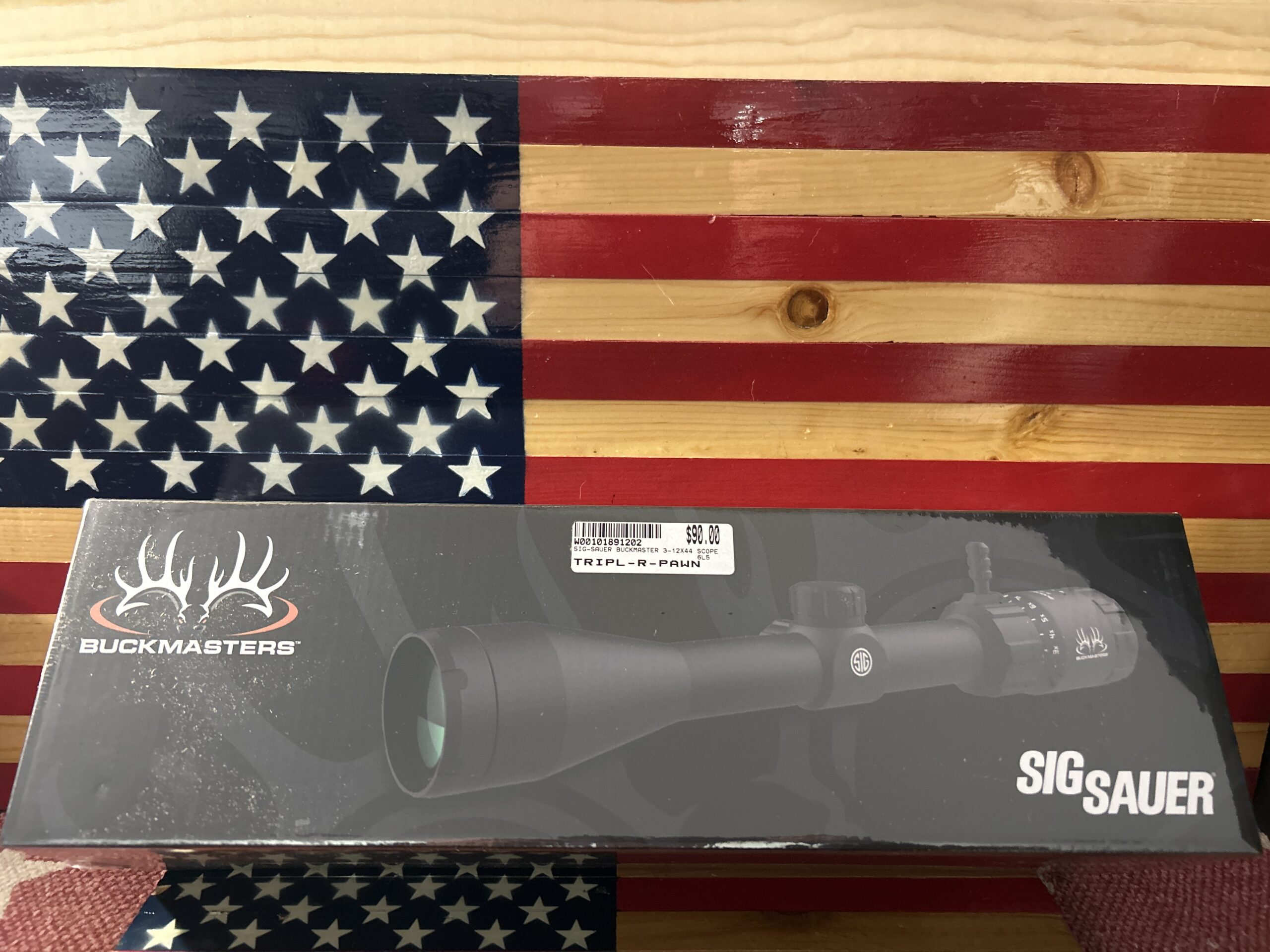 Buckmasters Sig Sauer scope on American flag background