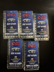 CCI Uppercut 22 WMR ammunition boxes on table.