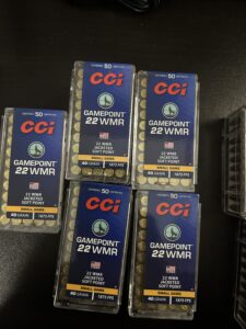 CCI Gamepoint .22 WMR ammunition boxes on table.